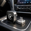 Denago draadloze CarPlay adapter in de middenconsole van een auto